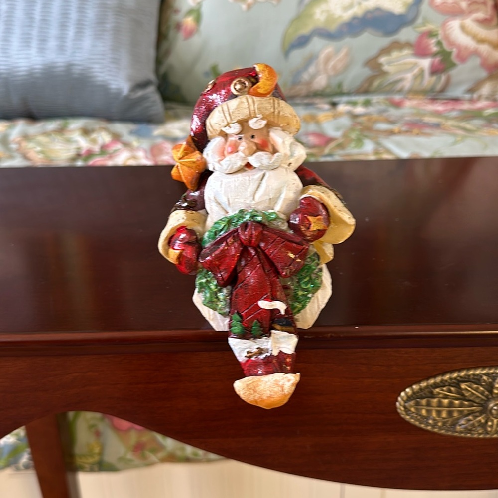 Santa stocking holder with crescent moon on hat.